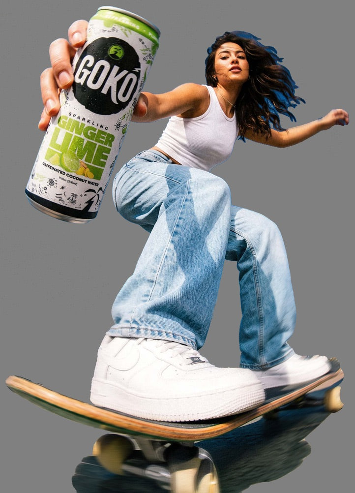 A skater holding out a can of GOKO Ginger Lime